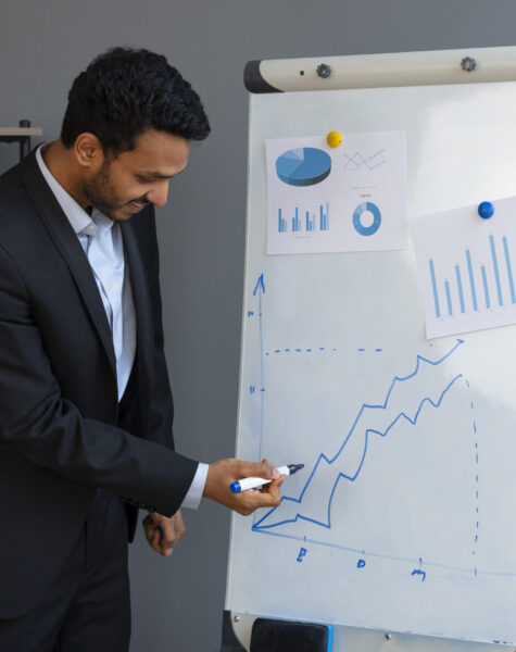 business-person-looking-finance-graphs business-person-looking-finance-graphs